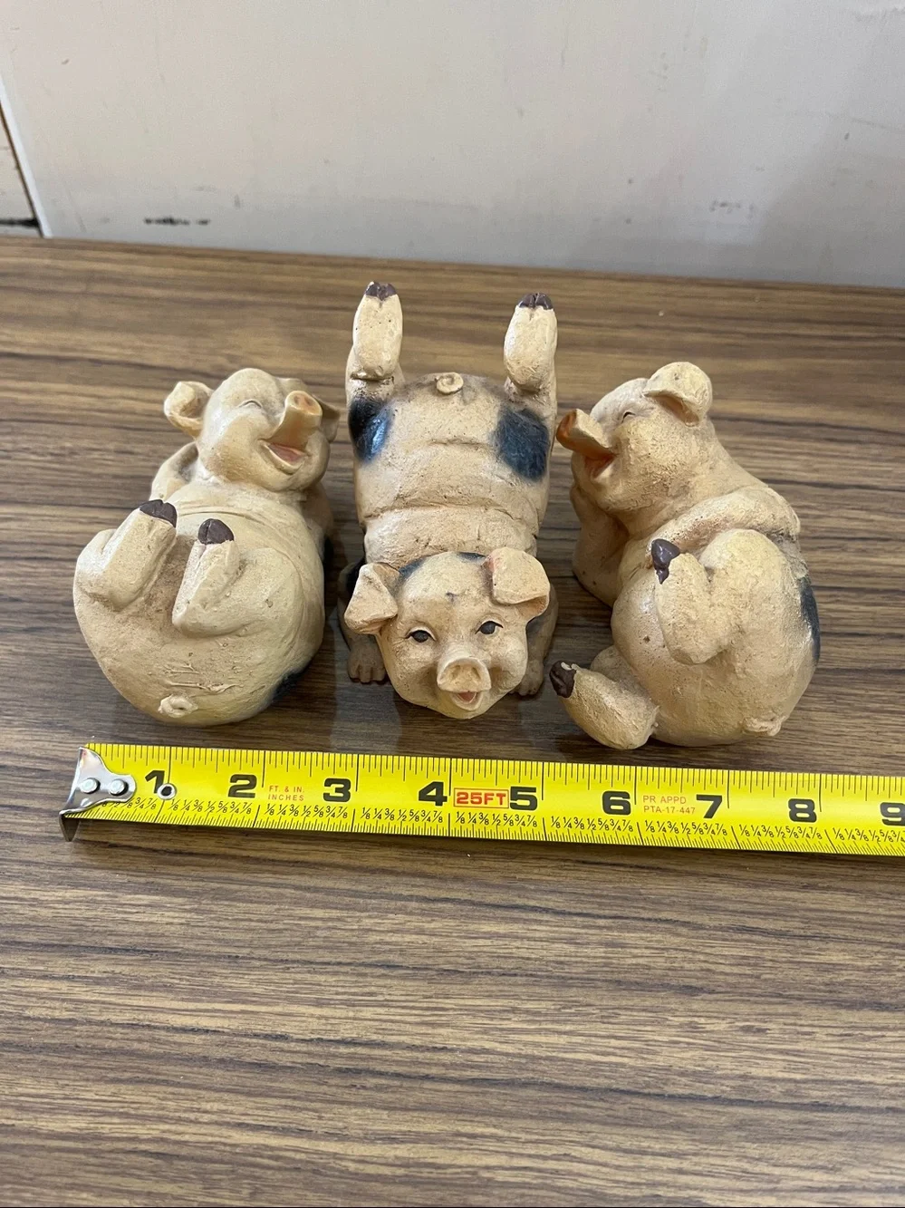Set of three frolicking pigs